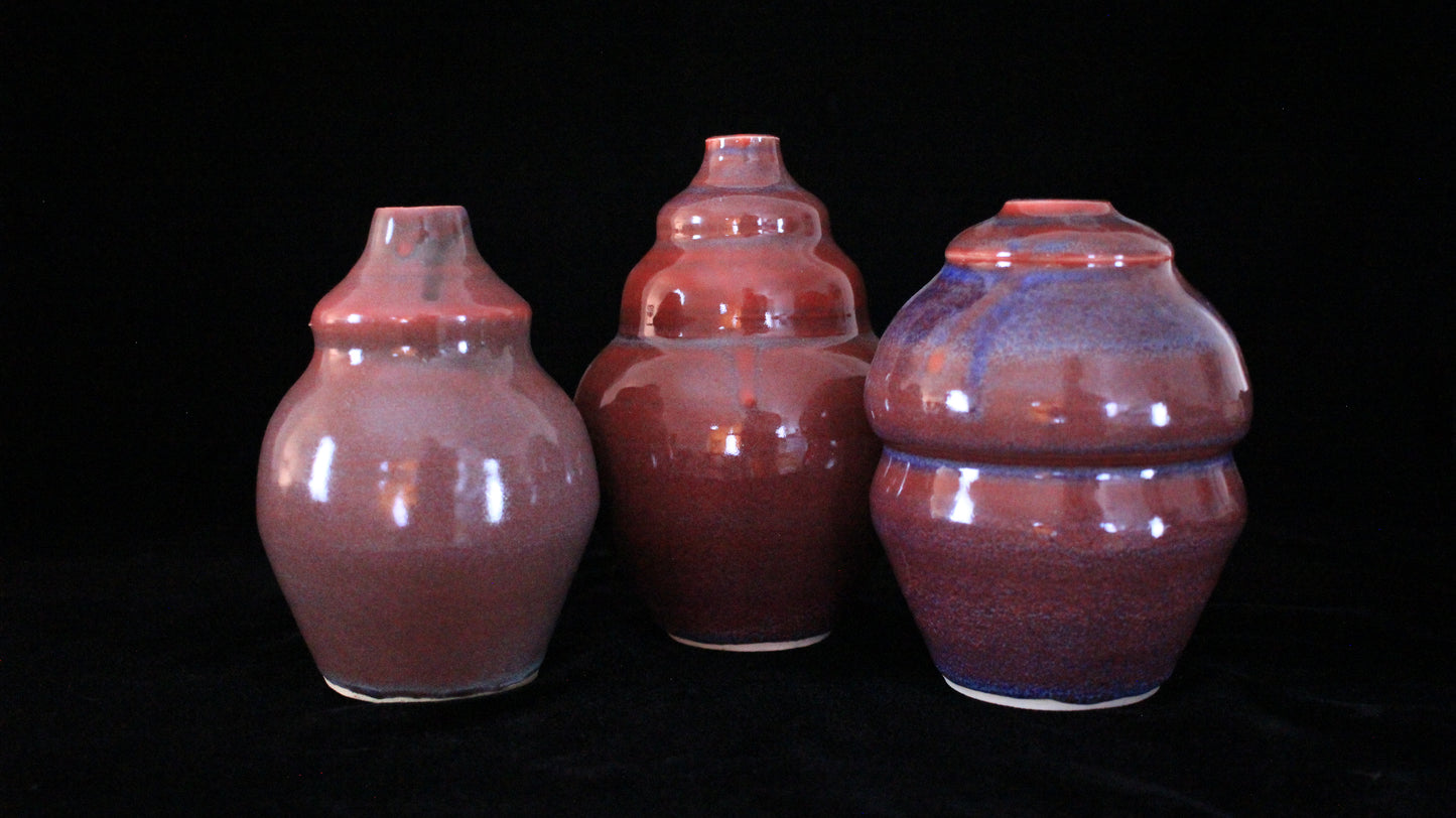 Three Danaides bottles