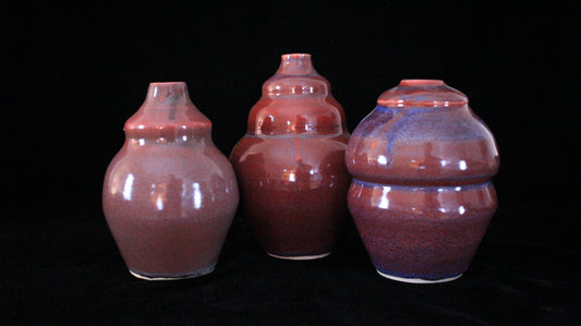 Three Danaides bottles